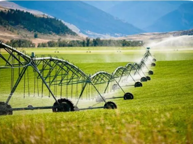 Centre pivot irrigation watering a field